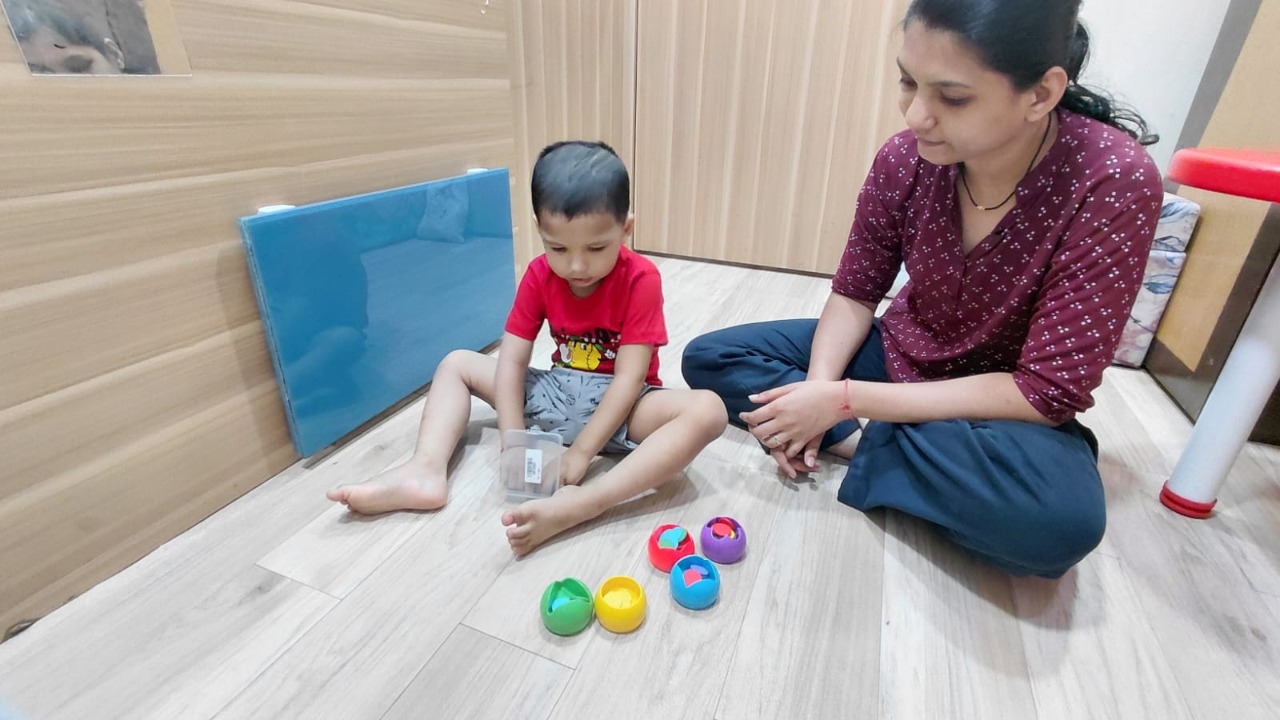 Child taking part in a guided developmental play session at Mansa Clinic
